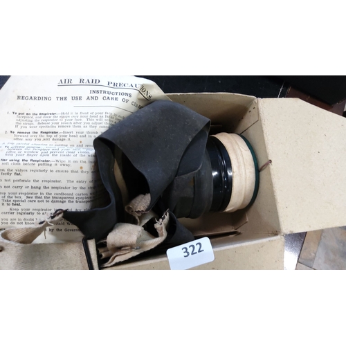 322 - WWII era civilian gas mask with original cardboard box and instructional leaflet. Complete respirato... 