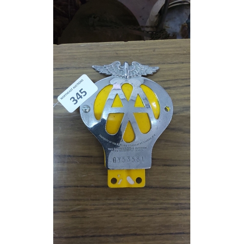 345 - Vintage AA Car Badge featuring a silver-tone finish, yellow accents, and an eagle motif. Marked with... 