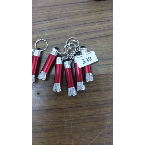 349 - 6 red and silver mini flashlight keychains.