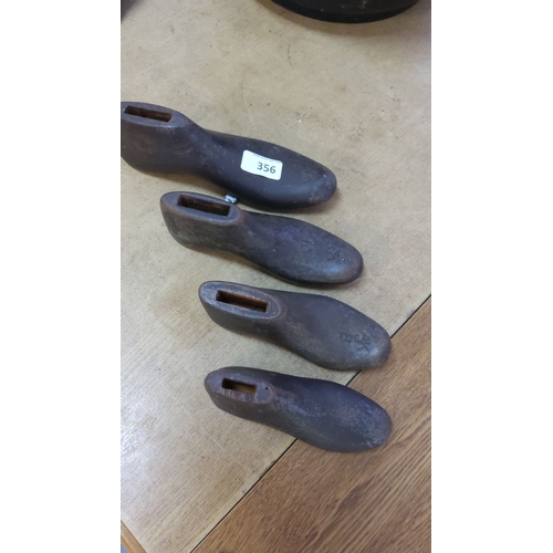 356 - Set of four antique cast iron cobbler's shoe lasts.