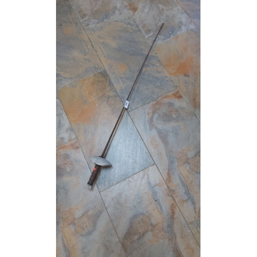 360 - Antique fencing foil with a wooden grip and metal guard. Likely from the early to mid-20th century.