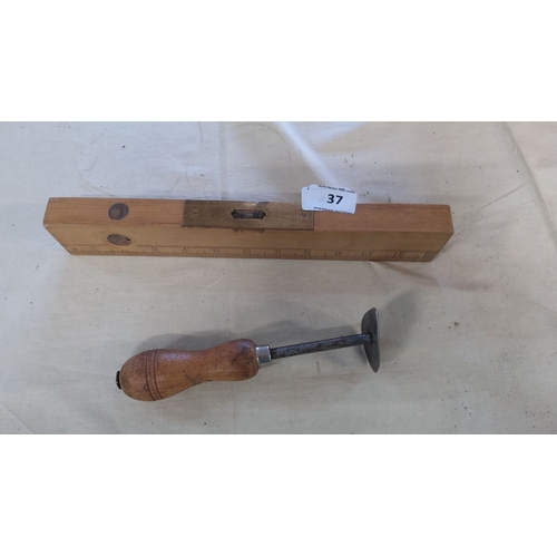 37 - Vintage wooden carpenter's spirit level and an edge marking tool with wooden handle and metal sectio... 