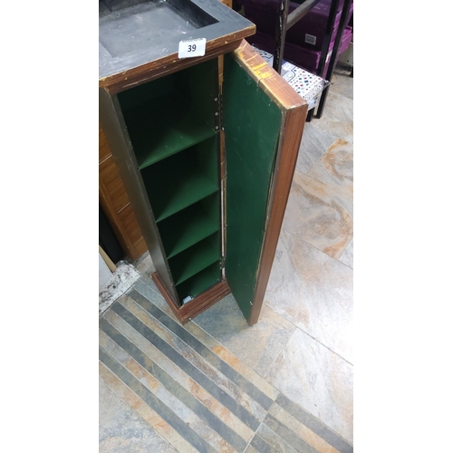 39 - Wooden display cabinet with glass front. Includes 2 golf clubs, 6 vintage golf balls, photographs, a... 