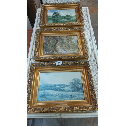 52 - Set of three framed landscape paintings, each depicting serene countryside scenes. Ornate gold frame... 