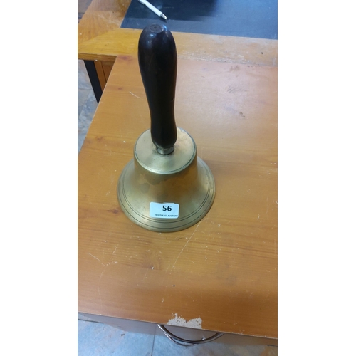 56 - Vintage brass hand bell with a wooden handle.