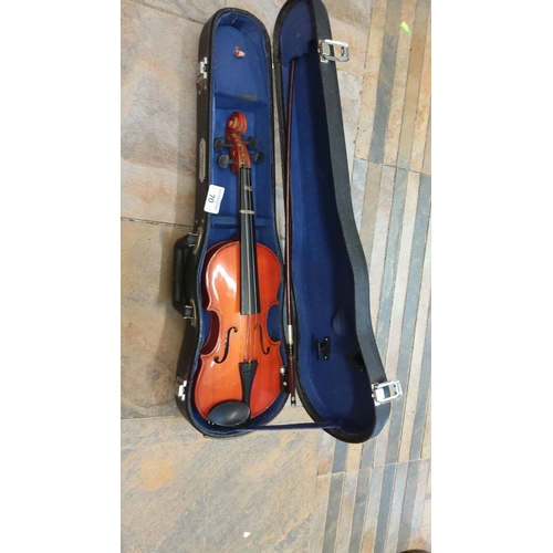 70 - Acoustic Violin in Carry Case with Bow. Features fine wood craftsmanship and includes a protective b... 