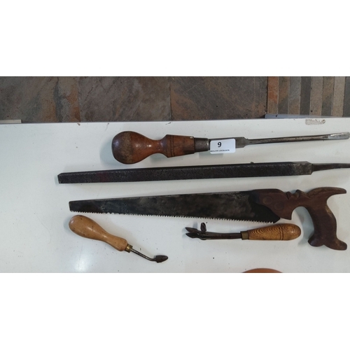 6 - Set of vintage hand tools including a wooden-handled screwdriver, metal file, handsaw with ornate wo... 