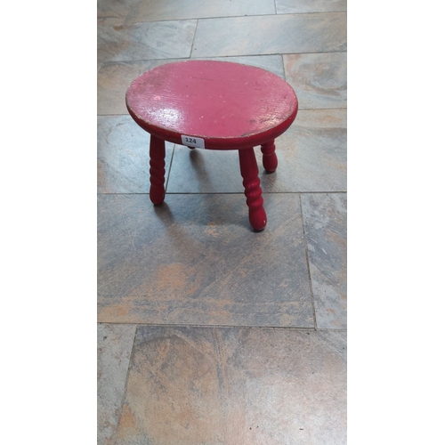 124 - Vintage red-painted wooden stool with turned legs.