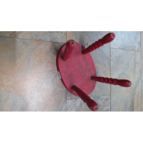 124 - Vintage red-painted wooden stool with turned legs.