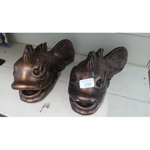 133 - Pair of concrete fish sculptures, detailed and textured.