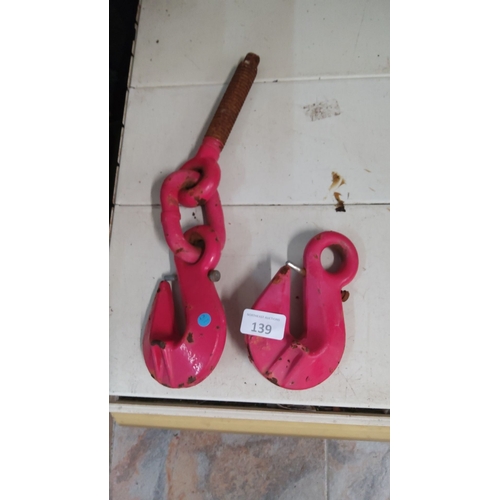 139 - Pair of heavy-duty red industrial hooks with threaded rod attachment. Rugged construction.