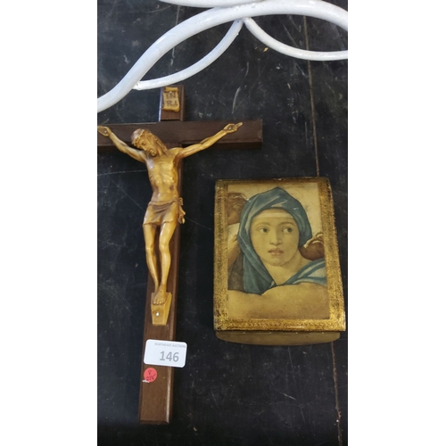 146 - Crucifix featuring detailed figure of Jesus and a small religious icon depicting a young woman in a ... 