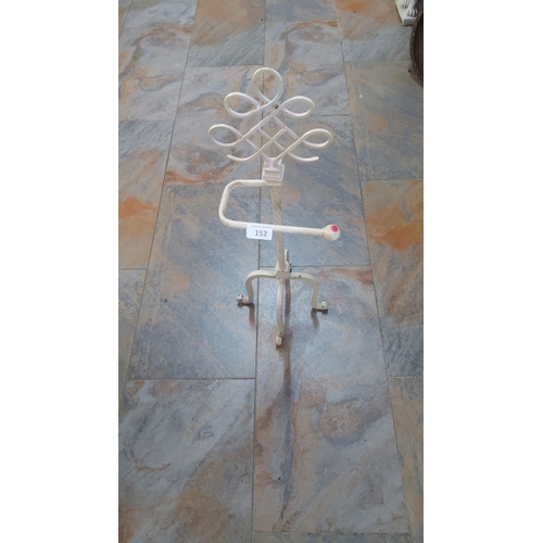 152 - Vintage white wrought iron toilet roll  stand with twisted central column and looped design top.