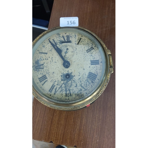 156 - Antique Smiths ships wall clock with brass casing. The clock features a Roman numeral dial and a sub... 