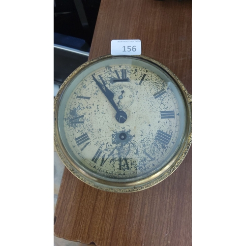 156 - Antique Smiths ships wall clock with brass casing. The clock features a Roman numeral dial and a sub... 