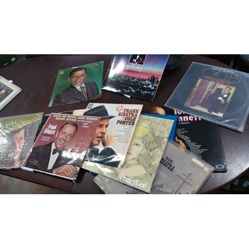 166 - Collection of vinyl records. Features Frank Sinatra, Peggy Lee, and Tony Bennett. Includes iconic al... 