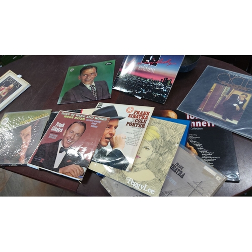 166 - Collection of vinyl records. Features Frank Sinatra, Peggy Lee, and Tony Bennett. Includes iconic al... 