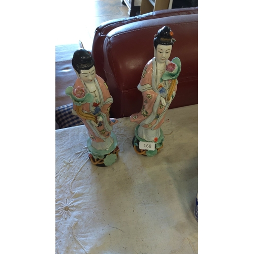 168 - Pair of Chinese porcelain figurines, hand-painted with floral motifs. The figurines depict female fi... 