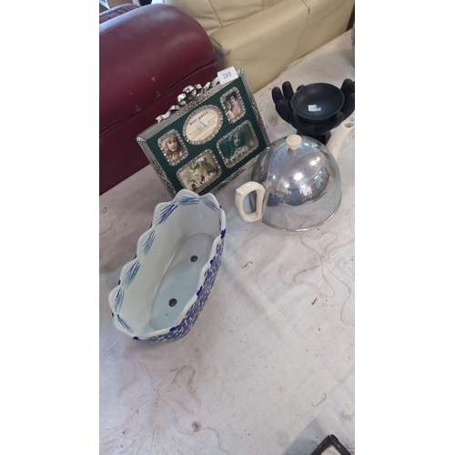 169 - Includes a green multi-photo frame, blue and white ceramic planter, a metallic teapot with ceramic h... 