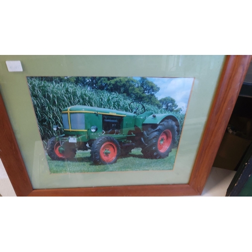 17 - Framed photograph of a vintage green Deutz tractor in a lush field. Features a wooden frame and gree... 