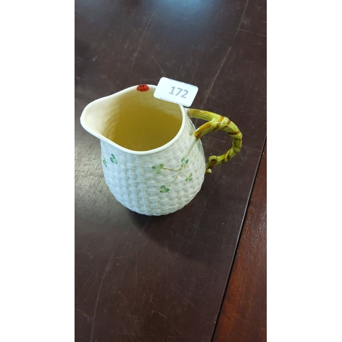 172 - Irish porcelain Belleek pitcher with hand-painted shamrock motifs and basket weave texture. Features... 