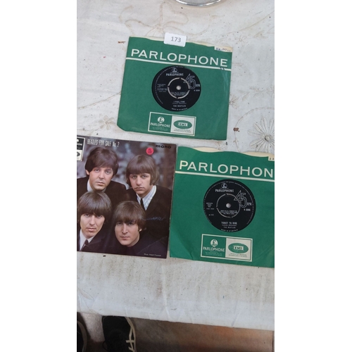 173 - The lot includes 3 Parlophone 45 RPM records by The Beatles
