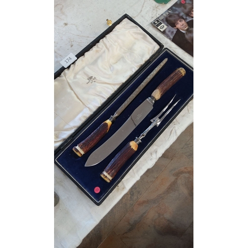174 - Walker & Hall Sheffield carving set in fitted case. Includes knife, fork, and sharpening steel with ... 