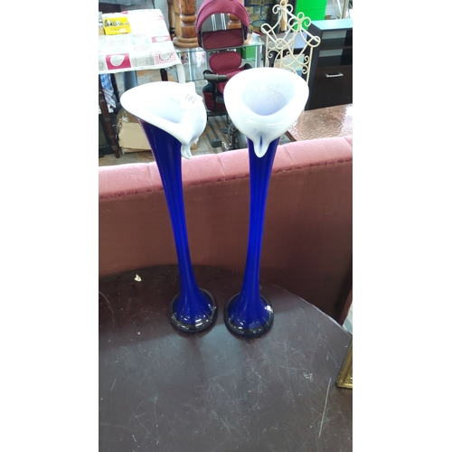 181 - Pair of cobalt blue and white glass trumpet vases with flared rims. Height: approximately 18 inches.