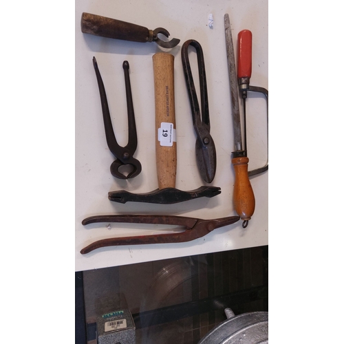 19 - Collection of six vintage metalworking tools, including hammers, pliers, and a file, featuring woode... 