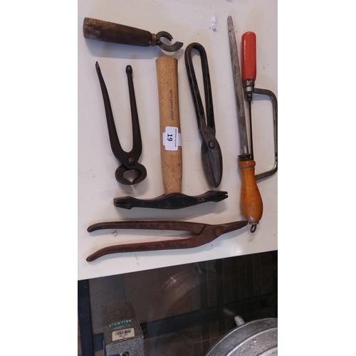 19 - Collection of six vintage metalworking tools, including hammers, pliers, and a file, featuring woode... 