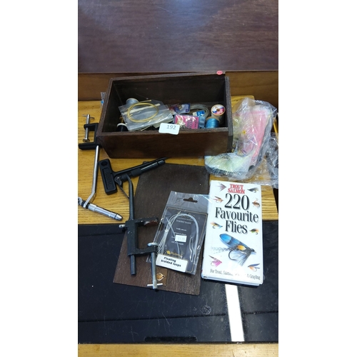 192 - Vintage fly fishing kit including assorted hooks, wires, a vise tool, and 
