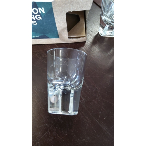 193 - Set of four Jameson branded tasting glasses with original cardboard box. Each glass holds 60 ml.