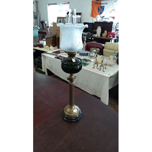 198 - Edwardian-style brass oil lamp with a frosted floral design glass shade and green glass oil reservoi... 