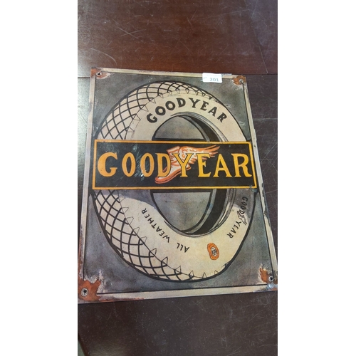 201 - Vintage Goodyear tin sign, featuring classic tire advertisement with vibrant logo. Approx. dimension... 