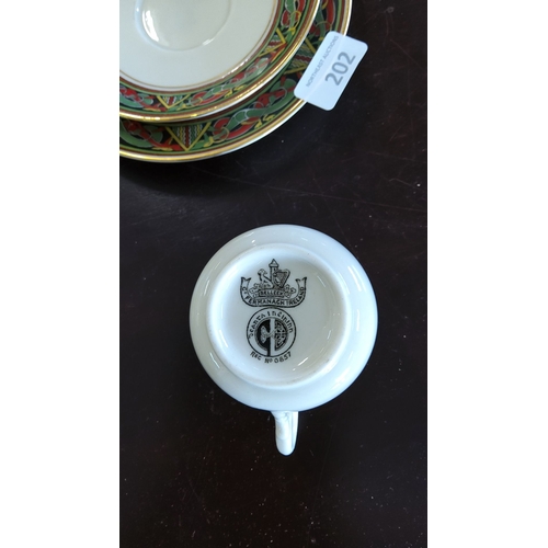 202 - Belleek fine porcelain cup and saucer,plate set. Features intricate multicolored pattern. Made in Co... 