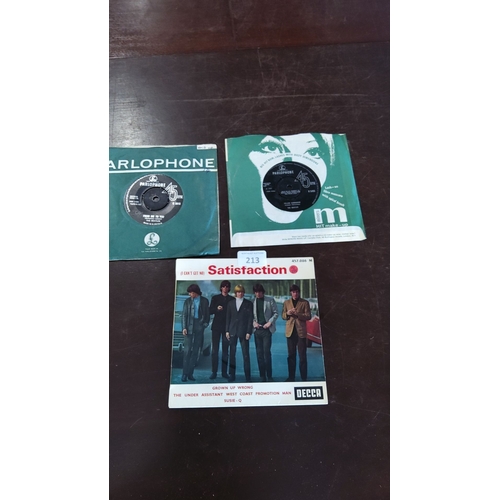 213 - Three vintage vinyl records featuring The Beatles and The Rolling Stones, including 