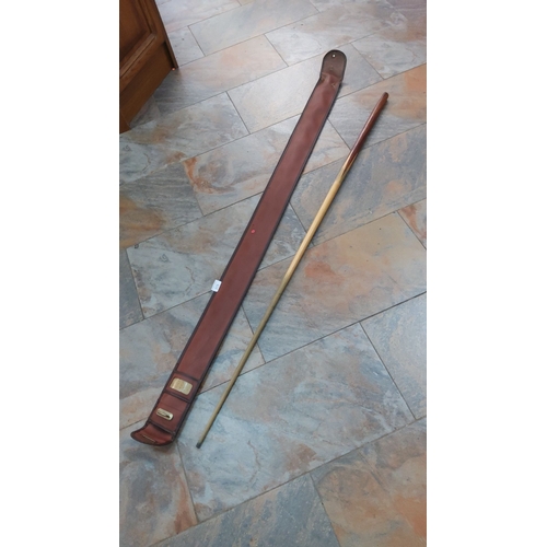 215 - Vintage BCE wooden billiard cue with brown leather case, featuring brass accents.