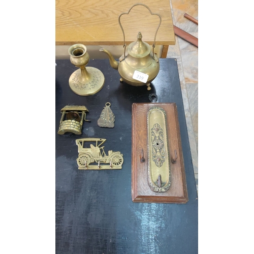 219 - Assorted vintage brass collectibles including a teapot, candlestick holder, well trinket box, ship p... 