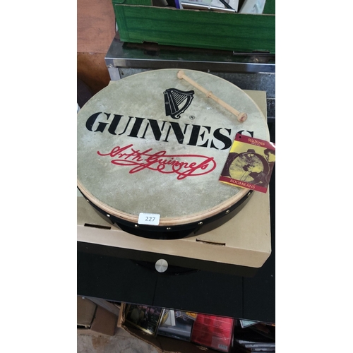 227 - Waltons Bodhrán drum with Guinness branding. Includes beater.