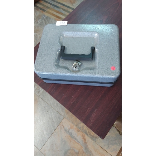 252 - Gray metal cash box with handle and lock.
