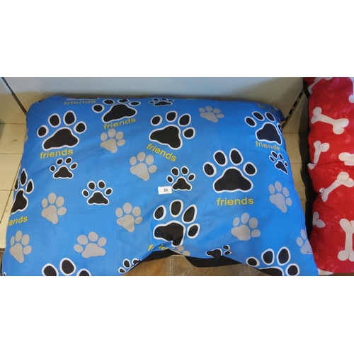 26 - Blue pet pillow with black and grey paw prints, featuring the word 