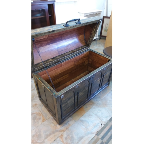 264 - Wooden Gothic Revival-style trunk with arched decorative panels and wrought iron accents, featuring ... 