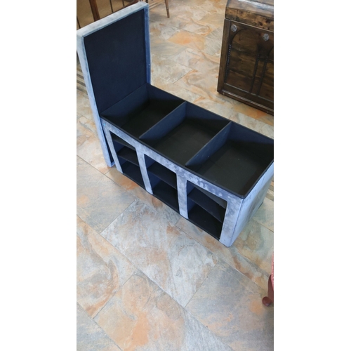 269 - Gray velvet storage bench with tufted seat and internal compartments. Features three front cubbies f... 
