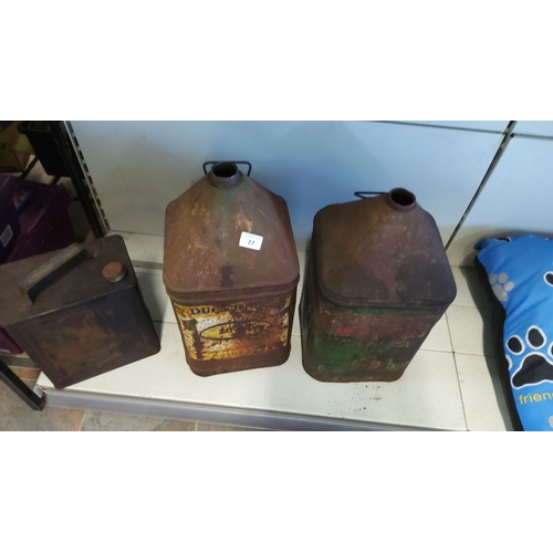 27 - Vintage fuel cans featuring a variety of designs and brands. The collection includes two large motor... 