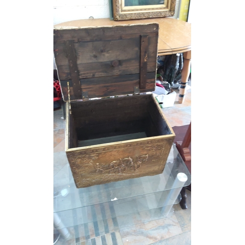 270 - Antique embossed brass storage chest with fabric upholstered lid. Features intricate pastoral scene ... 