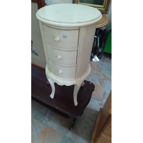 272 - Vintage round side table with three drawers. It has a distressed ivory finish and features cabriole ... 