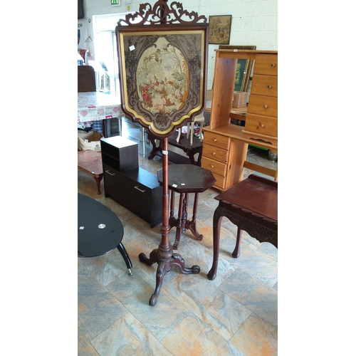 286 - Victorian mahogany pole screen with tapestry insert, featuring floral and bird motif, standing on in... 