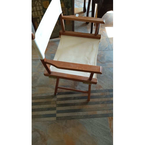 289 - Vintage wooden director's chair with canvas seat and backrest. Features a foldable frame for easy st... 