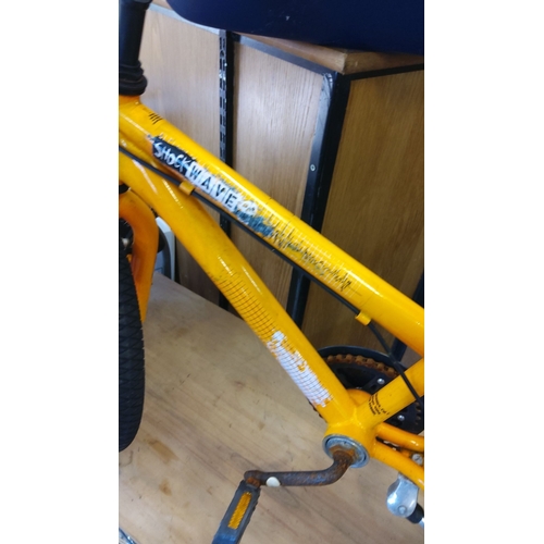 292 - Orange children's bicycle with training wheels, labeled 
