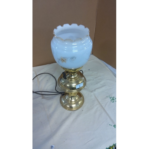 3 - Victorian-style brass electric table lamp with a milk glass shade featuring delicate floral patterns... 